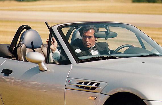 Brosnan's stunt double with gun in BMW
